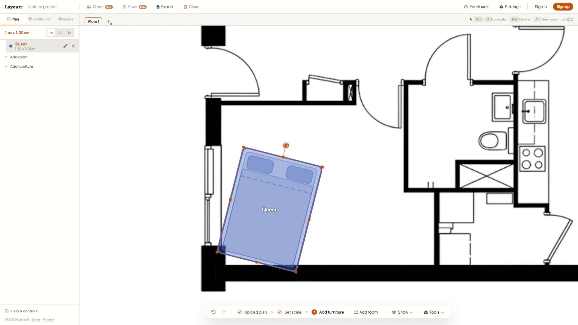 A queen bed in the bedroom being turned with the rotation handle on top, halfway through a quarter turn.